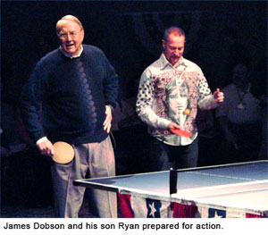 James Dobson and his son Ryan prepare for Ping Pong battle at the National Religious Broadcasters' confereence in Anaheim